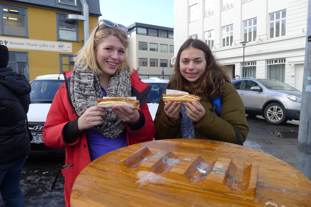 Icelandic Kristin and Amelia with hotdogs in Reykjavik